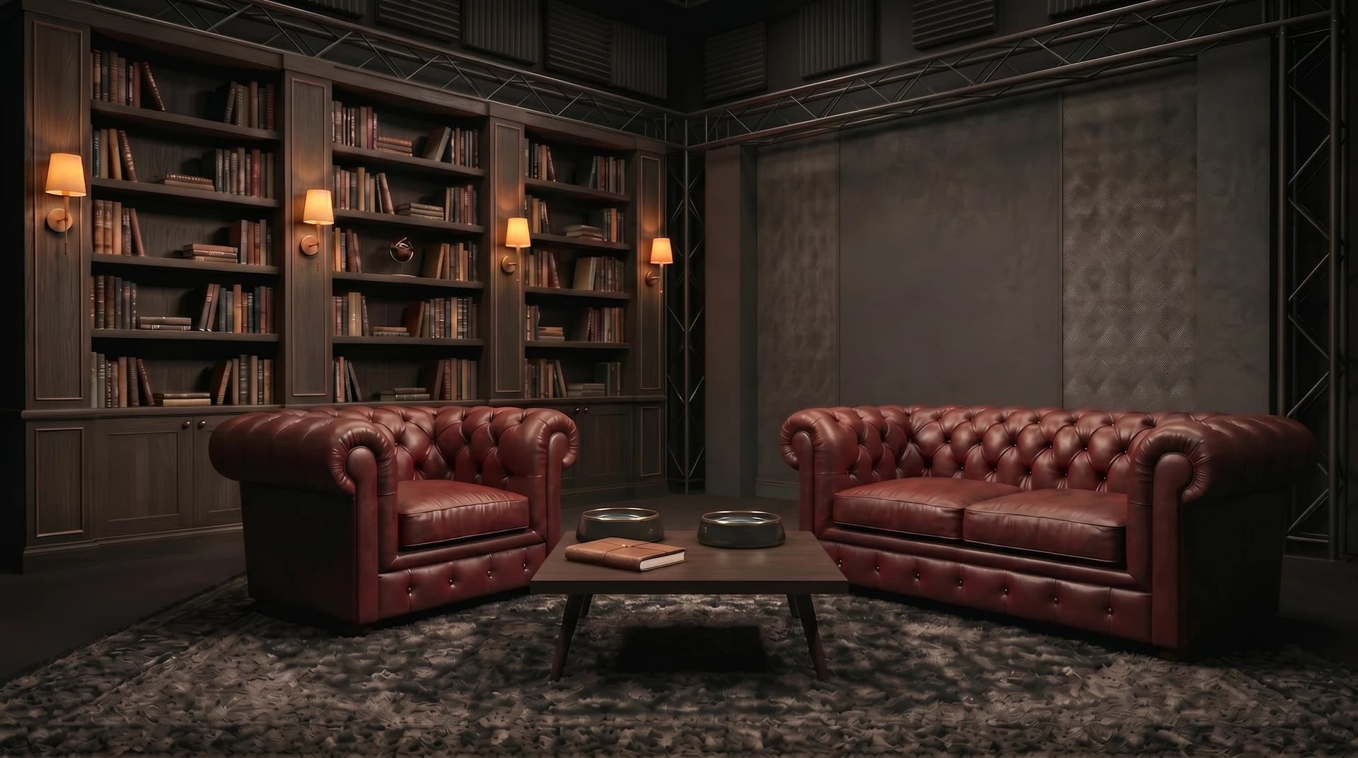 Das Studio: oxblutrote Chesterfield-Möbel, eine dunkle Bibliothek mit warmen Lampen, zwei Wassernäpfe auf dem Couchtisch